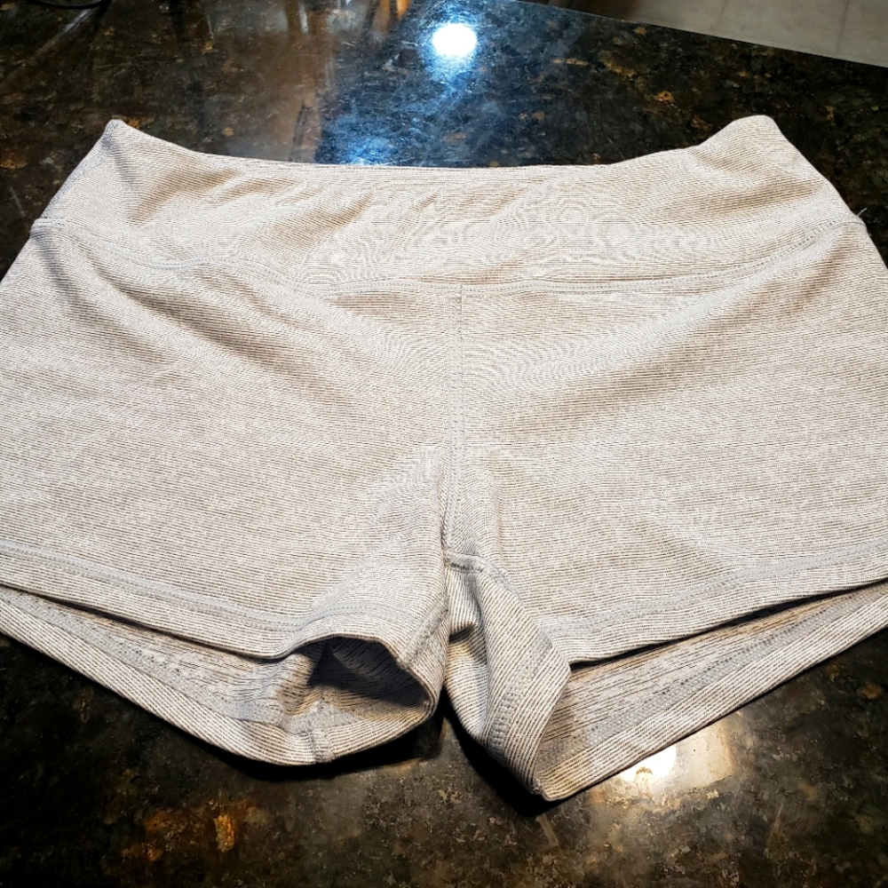 Black micro striped on gray shorts..born primitive..size small.